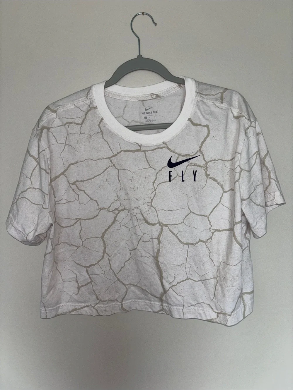Nike White Cropped Tee with Beige Crackle Design